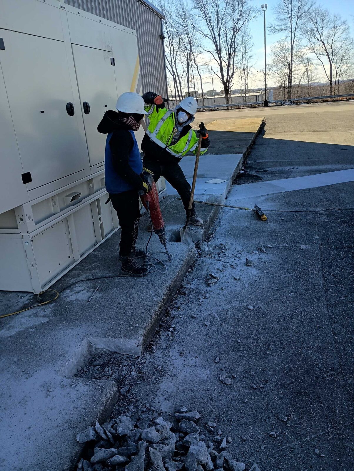Concrete-filled bollards installed by Concrete Solutions Massachusetts