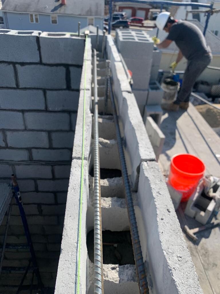 CMU block wall reinforced construction by Concrete Solutions MA
