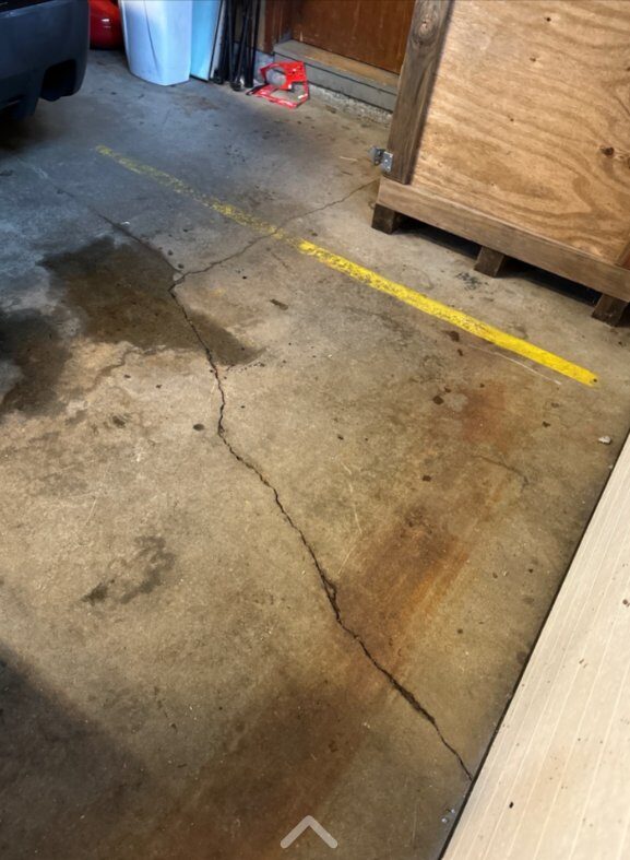 Polyurethane crack injection on garage slab by Concrete Solutions Massachusetts