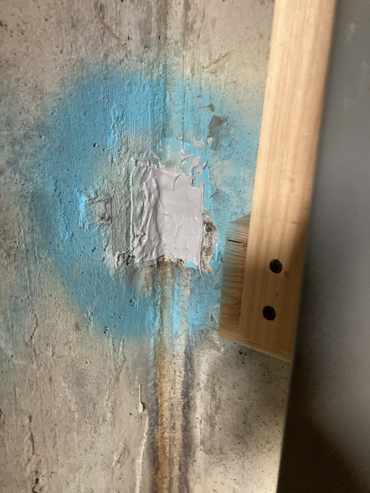Active foundation crack injection in progress by Concrete Solutions Massachusetts