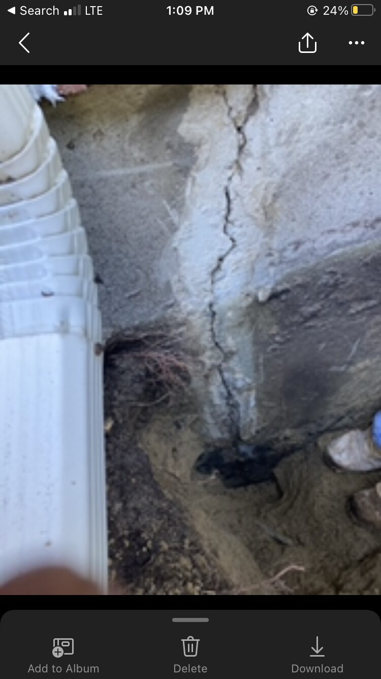 Excavated foundation prepared for exterior waterproofing by Concrete Solutions in Massachusetts