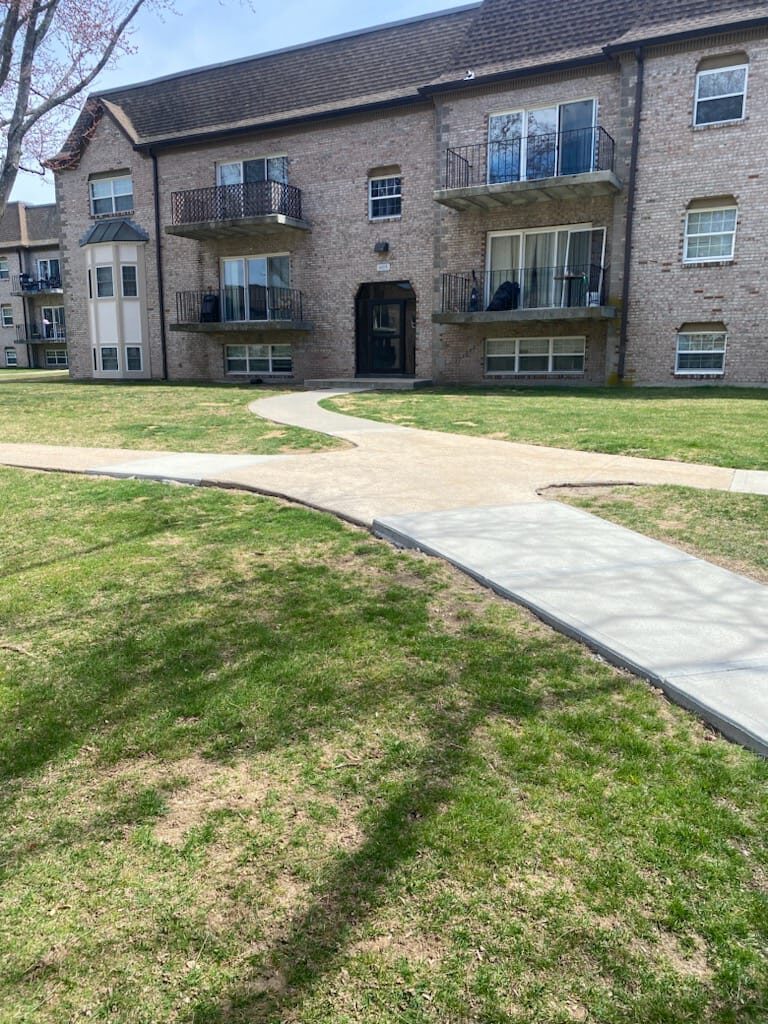 HOA concrete sidewalk before repair by Concrete Solutions Massachusetts