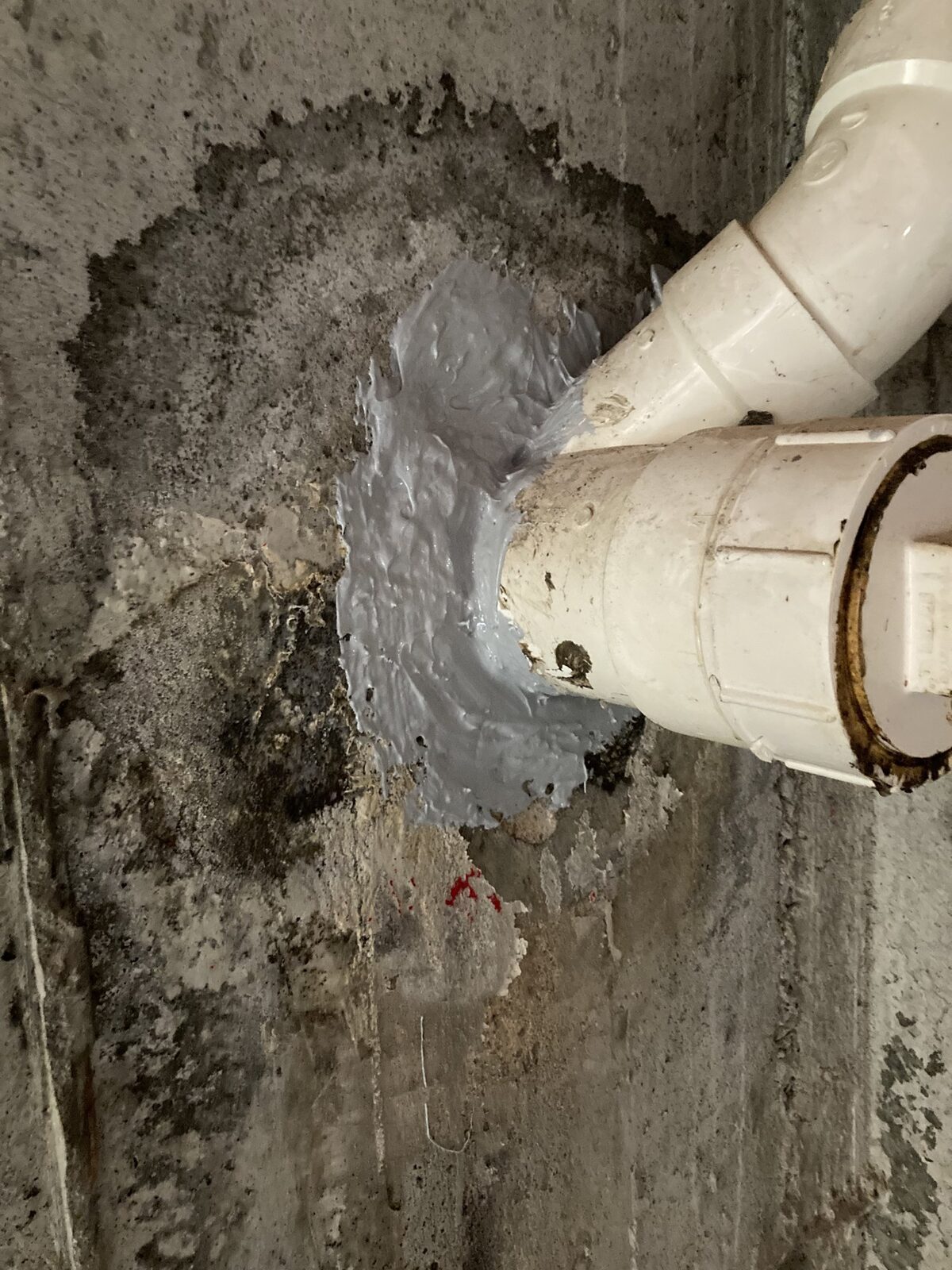 Interior basement waterproofing pipe penetration seal by Concrete Solutions in Massachusetts