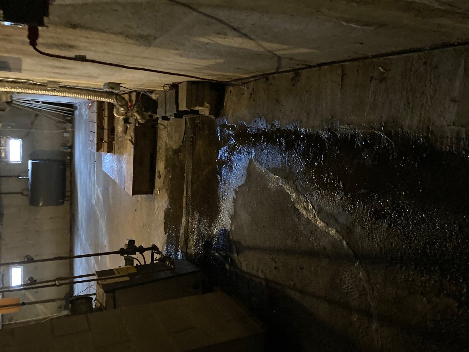 Sump pump installation in Massachusetts basement by Concrete Solutions